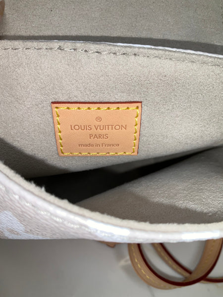 Louis Vuitton tiny backpack by the pool