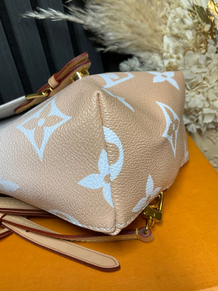 Louis Vuitton tiny backpack by the pool